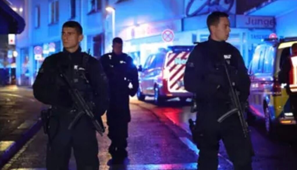 “Germany Pursues Massacre Perpetrator: Scholz Calls for Swift Arrest and Trial”